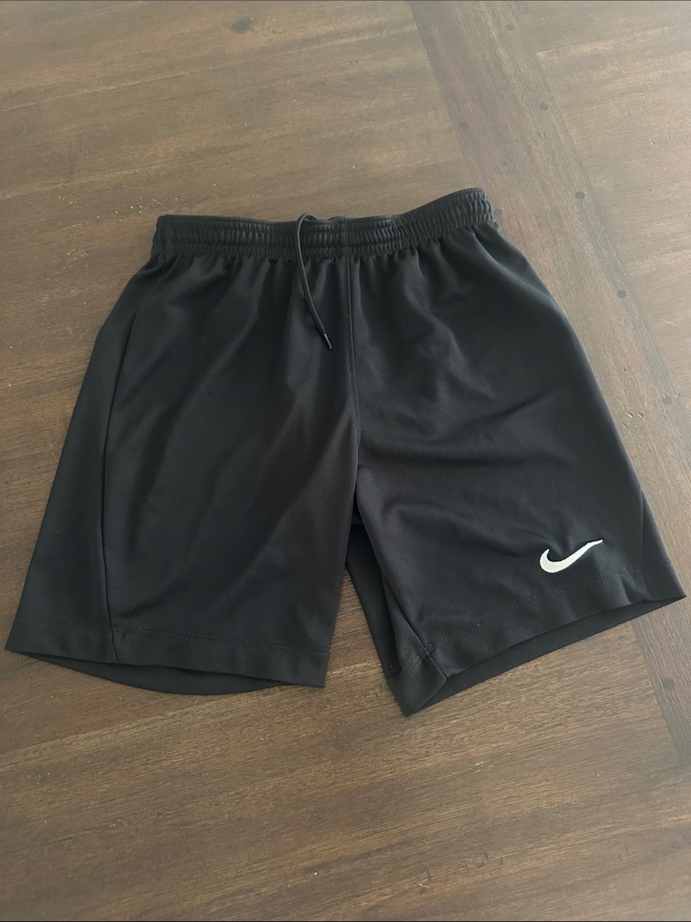 Nike youth medium Black Athletic Shorts with White Swoosh